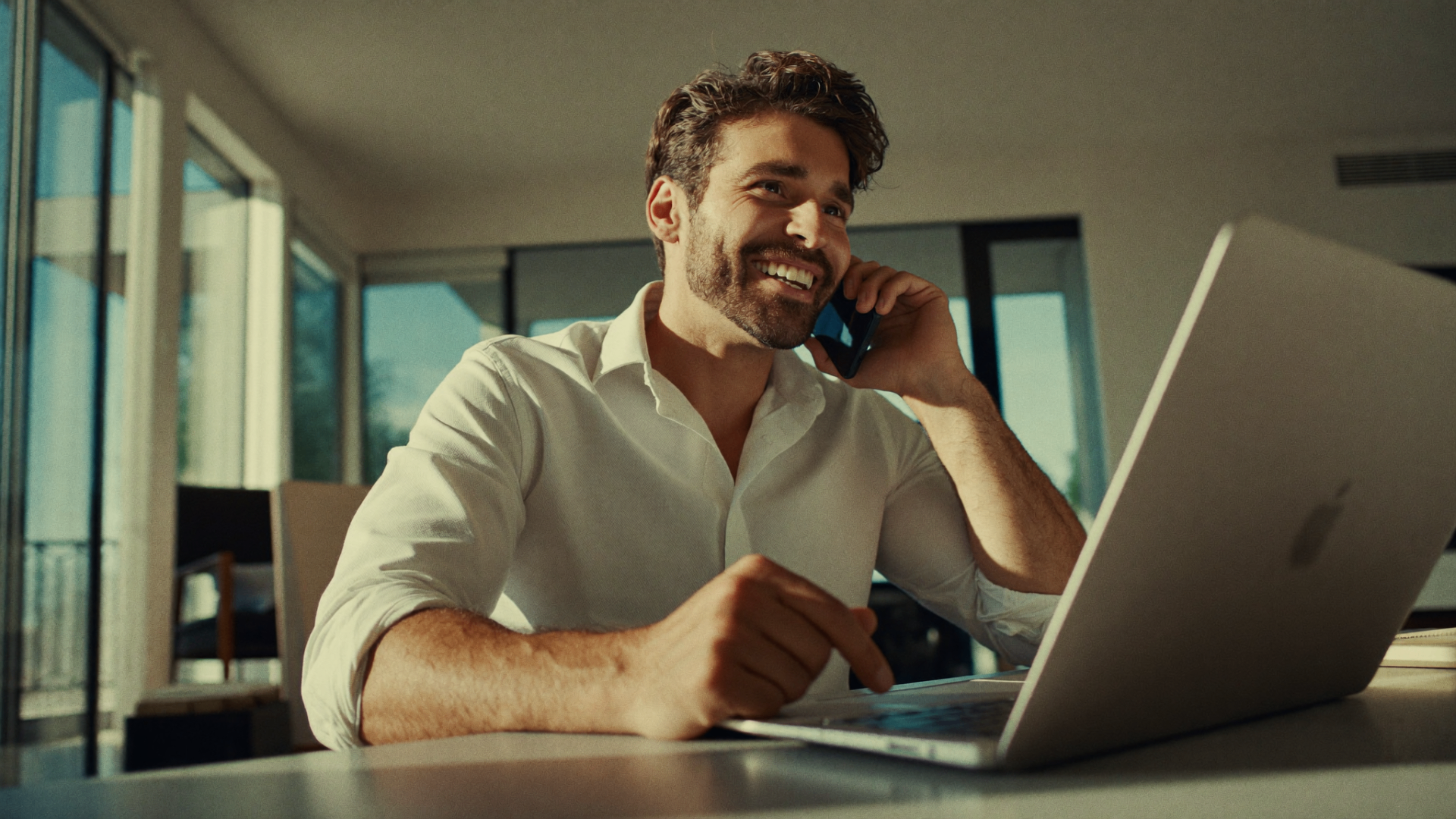Representative on a call from a bright modern workspace